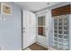 Inviting entryway featuring a front door, side window and blue painted wall at 5300 S Atlantic Ave # 16-202, New Smyrna Beach, FL 32169