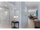 Bright hallway with tile flooring, leading to the dining area and featuring stylish decor at 5300 S Atlantic Ave # 16-202, New Smyrna Beach, FL 32169