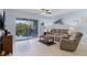 Comfortable living room with access to a private balcony at 5300 S Atlantic Ave # 16-202, New Smyrna Beach, FL 32169