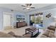 Bright and airy living room opens to a balcony with comfortable seating and scenic views at 5300 S Atlantic Ave # 16-202, New Smyrna Beach, FL 32169