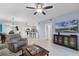 Cozy living room with tile floors and an open floor plan to the kitchen and dining area at 5300 S Atlantic Ave # 16-202, New Smyrna Beach, FL 32169