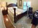 Bedroom features a decorative ceiling fan, wood flooring and a large window for natural light at 5375 Compass Pt # 04, Oxford, FL 34484