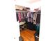 Spacious walk-in closet features custom shelving and ample storage for clothing, shoes, and accessories at 5375 Compass Pt # 04, Oxford, FL 34484