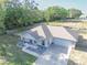 Beautiful aerial view showcasing a well-maintained home, landscaped front yard, and a spacious driveway at 548 E Belt Ave, Bushnell, FL 33513