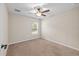 Cozy bedroom featuring neutral carpet, neutral walls, a ceiling fan, and a sunlit window at 548 E Belt Ave, Bushnell, FL 33513