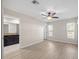 Bedroom with wood-look floors, neutral paint, ceiling fan and an ensuite bathroom at 548 E Belt Ave, Bushnell, FL 33513