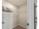 Walk-in closet featuring wood-look floors and wire shelving for storage at 548 E Belt Ave, Bushnell, FL 33513