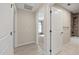 Hallway featuring neutral paint, a view into the bedroom, and the bathroom entrance at 548 E Belt Ave, Bushnell, FL 33513