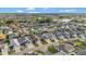 Expansive community view with well-manicured lawns and a scenic pond at 5702 Grimes Ct, The Villages, FL 32163