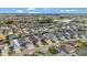 Expansive community view with well-manicured lawns and a scenic pond at 5702 Grimes Ct, The Villages, FL 32163