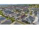 Neighborhood aerial view showcasing community layout and home exteriors at 5702 Grimes Ct, The Villages, FL 32163