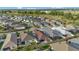 Aerial view of a residential area with well-maintained lawns and varied roof colors at 5702 Grimes Ct, The Villages, FL 32163