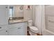 Bathroom featuring a granite vanity with new fixtures and a shower/tub combination at 5702 Grimes Ct, The Villages, FL 32163