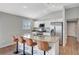 Kitchen featuring a granite island with bar seating and stainless steel appliances at 5702 Grimes Ct, The Villages, FL 32163