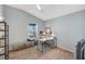 Bright home office featuring a ceiling fan, large window, and multiple work spaces at 5702 Grimes Ct, The Villages, FL 32163