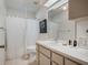 Bright bathroom features a shower and tub combo, storage and a neutral design at 5906 Prince Philip Ct, Leesburg, FL 34748