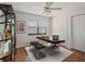 Well-lit office space featuring a large desk, sleek decor, and a view from the window at 5906 Prince Philip Ct, Leesburg, FL 34748