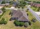 Aerial view of property showing meticulously landscaped grounds and the layout of the home in its community at 630 Laurel Run, The Villages, FL 32162
