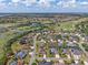 Aerial view showcasing the neighborhood layout, nearby golf course, and surrounding landscape at 630 Laurel Run, The Villages, FL 32162