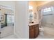 Hall bathroom featuring a tub with shower and granite countertop vanity at 630 Laurel Run, The Villages, FL 32162