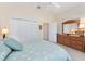 Bedroom with ceiling fan, double closet and dresser at 630 Laurel Run, The Villages, FL 32162