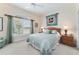 Bedroom showcasing a large window with shutters and coordinating decor at 630 Laurel Run, The Villages, FL 32162