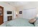 Bedroom with ceiling fan, storage and adjacent living room at 630 Laurel Run, The Villages, FL 32162