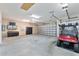 Spacious three car garage with plenty of room for storage and a golf cart at 630 Laurel Run, The Villages, FL 32162