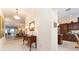 Hallway showcasing access to the dining and living areas, with stylish decor at 630 Laurel Run, The Villages, FL 32162
