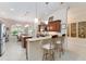 Kitchen featuring granite counters, stainless appliances, breakfast bar, and breakfast nook at 630 Laurel Run, The Villages, FL 32162