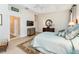 Relaxing main bedroom features an ensuite bathroom, hardwood floors and designer decor at 630 Laurel Run, The Villages, FL 32162