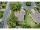 Aerial view of property showcasing landscaping and surrounding neighborhood at 725 Beldon Ct, The Villages, FL 32162