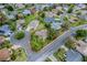 Aerial view of a home situated on a corner lot with mature landscaping and adjacent to a quiet cul-de-sac at 725 Beldon Ct, The Villages, FL 32162