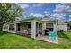 Spacious backyard with screened patio, perfect for outdoor entertaining at 725 Beldon Ct, The Villages, FL 32162