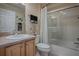 Well-maintained bathroom with glass shower door and neutral color scheme at 725 Beldon Ct, The Villages, FL 32162