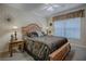 Bright bedroom with a light-colored bed frame and a sunlit window at 725 Beldon Ct, The Villages, FL 32162