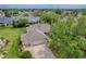 View of a house featuring an attached three-car garage, driveway, and well-maintained landscaping at 725 Beldon Ct, The Villages, FL 32162