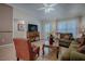 Comfortable living room featuring a plush sofa, natural light, and a functional layout at 725 Beldon Ct, The Villages, FL 32162