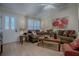 Inviting living room with vaulted ceilings, hardwood floors, and a comfortable seating arrangement at 725 Beldon Ct, The Villages, FL 32162
