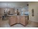 Open concept kitchen island that connects to living areas at 725 Beldon Ct, The Villages, FL 32162