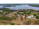 Expansive aerial view showcases the large lot and surroundings of this private home near the lake at 7973 Lake Nellie Rd, Clermont, FL 34714