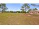 Spacious backyard featuring a screened pool, a workshop/garage, and ample room for outdoor activities at 7973 Lake Nellie Rd, Clermont, FL 34714