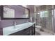 Contemporary bathroom featuring a double vanity sink and walk-in shower at 7973 Lake Nellie Rd, Clermont, FL 34714