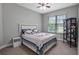 Bedroom with plush carpeting, a bed, and a window offering natural light at 7973 Lake Nellie Rd, Clermont, FL 34714