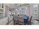 Bright dining area featuring large windows, recessed lighting, and a view of the backyard at 7973 Lake Nellie Rd, Clermont, FL 34714