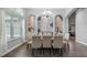 Elegant dining room with wood floors, ample seating, and custom alcoves at 7973 Lake Nellie Rd, Clermont, FL 34714