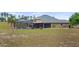 Expansive backyard with screened pool, patio, and well-maintained lawn, offering a serene outdoor living experience at 7973 Lake Nellie Rd, Clermont, FL 34714