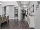 Hallway with arched doorway transitions to dining room, living room, and kitchen at 7973 Lake Nellie Rd, Clermont, FL 34714