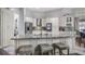 Kitchen island featuring granite countertop with bar stool seating at 7973 Lake Nellie Rd, Clermont, FL 34714