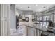 Bright and spacious kitchen with granite countertops, stainless steel appliances and custom cabinetry at 7973 Lake Nellie Rd, Clermont, FL 34714